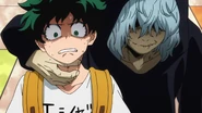 Tomura threatens Izuku in the shopping center.