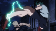 Izuku kicks Katsuki in the face.