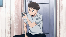 Koichi washes Iwao's weapon