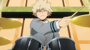 Katsuki shows off his drumming skills at the behest of other students.
