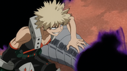 Katsuki pins down Kurogiri by his neck brace.