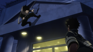 Eraser Head dodges "Dabi's" attack.