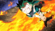 Izuku carries Yo away from the fire.