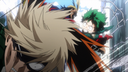 Izuku punches Katsuki and pleads for him not to quit.