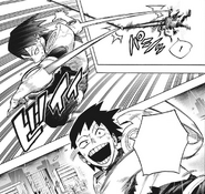 Hanta grabs ahold of Izuku with his Tape.