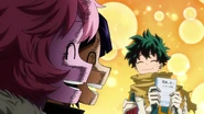 Izuku shows his notebook to his classmates.