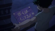 Izuku reads the message that Yuga left