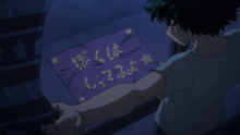 Izuku reads the message that Yuga left