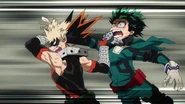 Katsuki prepares to throw Deku.