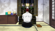 Enji praying at Toya's altar