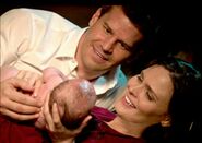 Brennan and Booth with newborn Christine