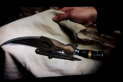 The Deity's Khukuri Knife and Masonic Compass.