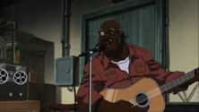 Ruckus playing a Guitar