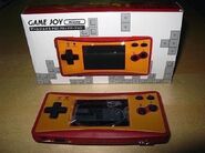 The Game Joy Micro with it's packaging.