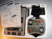 Dendy Classic bundled with gamepads, DC adapter, manual and warranty card. Photo by Valera Kibiks.