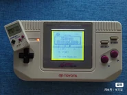 Toyota branded Game Fighter running Super Mario Land, likely an aftermarket modification.