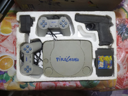 Another opened PikaGame box. This image shows a clear shot of the PikaGame cartridge, as well as two controllers under the "Victor" branding.