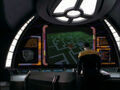 Ensign Kim traverses an unknown deck number, heading towards the shield generator.