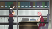 Shizune visits Sakura in her office.
