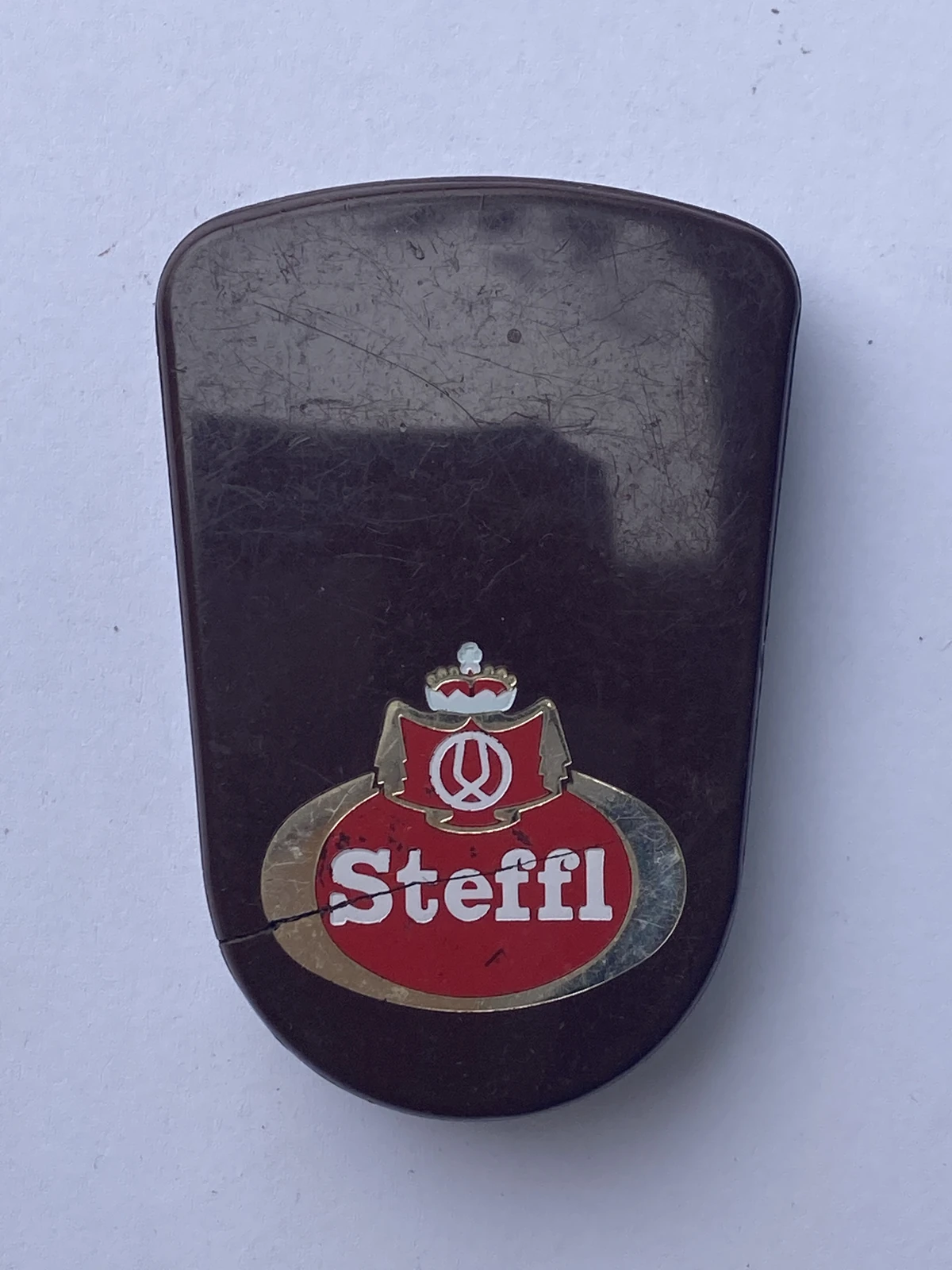 Steffl tiny brown plastic bottle opener with builtin cork Bottle
