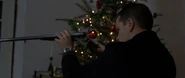 Bourne loads the shotgun