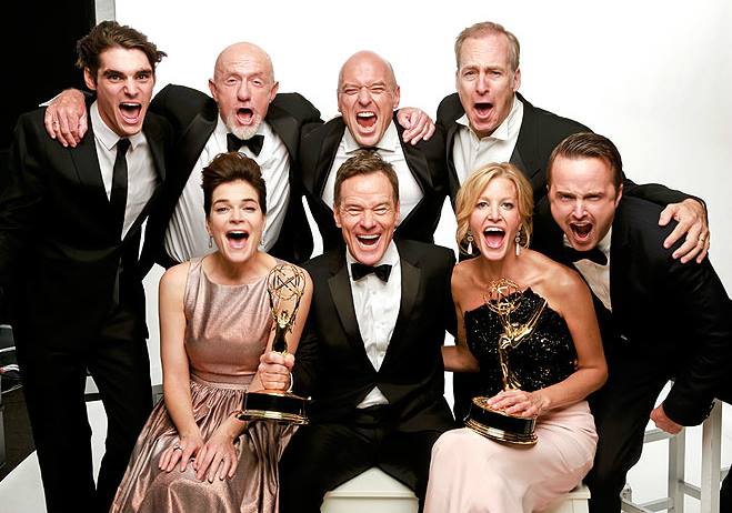 The cast showing off their awards