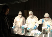 Victor oversees workers putting bags of blue meth in specially marked fry batter tubs