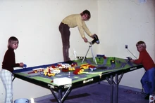 "The city and landscape on top of a table tennis (ping pong) table. Lars with the camera, Henrik at the launch site holding the 500W lamp and Inger painting the sea"