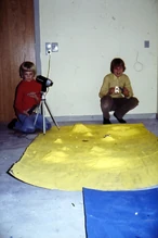 "Henrik filming at the moon landscape, Lars is holding the lunar module."
