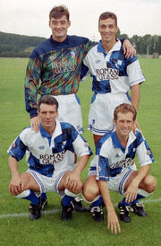 Alexander (front row, left) with teammates ,  and 