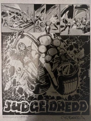 The original first page of Carlos Ezquerra's first Dredd strip, with his prototype logo.