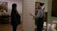 Shots filmed from the side while oversized jacket is straightened out to hide her stomach.