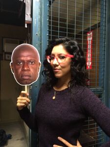 Stephanie Beatriz modeling Holt Halloween mask