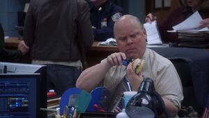 S5 E13 Shaving his sandwich at his desk