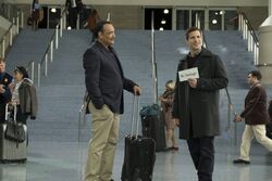 Jake picks up Amy's dad at the airport.