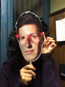 Stephanie Beatriz demonstrating Jake Halloween mask