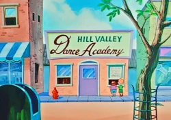 Two children standing outside Hill Valley Dance Academy.