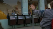 Several girls in the aerobics center wave to Marty as he passes by.