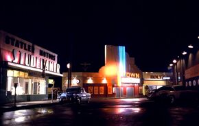 Statler Studebaker, Louis Watch Maker, Town Theater and Holt's Diner by night