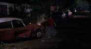 Marty walks past a wrecked Citroën DS in 1985A.