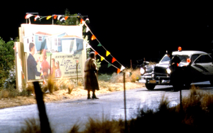 Peabody and policeman near Lyon Estates billboard