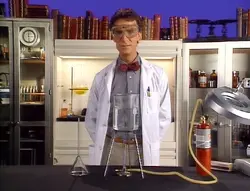 Bill Nye, con su bata de laboratorio y corbatín, durante los archivos de la enciclopedia de video que aparecen en los segmentos finales de acción en vivo de Back to the Future: The Animated Series.