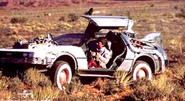 Marty in the DeLorean with binoculars.