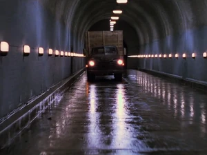 The backdrop placed at the far end of the tunnel can be clearly seen in this shot, based on where the pattern of lights on the ceiling changes.