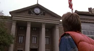 Marty looks up at the Courthouse's still-working clock in 1955.