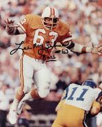 Lee Roy Selmon himself autographed this picture of him about to sack the Los Angeles Rams' Pat Haden.