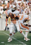 Dickinson looks for a receiver as Ed Williams blocks, against the San Diego Chargers.