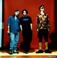 Primus, left to right: Tim Alexander, Larry LaLonde, Les Claypool, in a promo picture circa 1995. (photo by Jay Blakesberg ©)