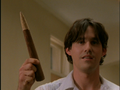 Xander holding Buffy's stake in confusion.