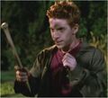 Oz holding a stake made from a baseball bat handle